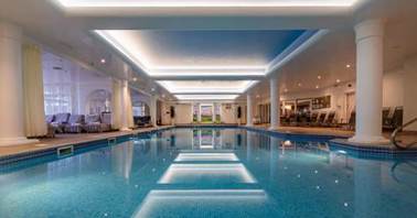 A swimming pool inside a building

AI-generated content may be incorrect.
