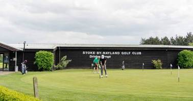 A group of people on a golf course

AI-generated content may be incorrect.