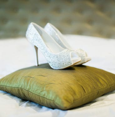 Bridal shoes on cushion