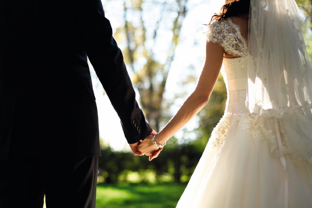 Weddings - couple holding hands
