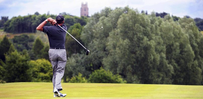 Golfer tees off at Stoke by Nayland, Essex