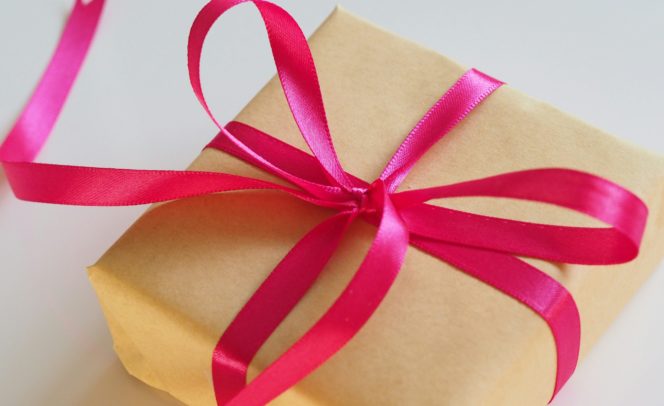 Gift box tied with a pink ribbon